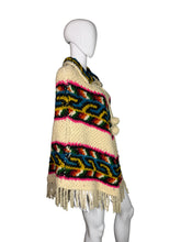Load image into Gallery viewer, Colorful knitted poncho with patterns on a mannequin against a white background
