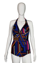 Load image into Gallery viewer, Multicolored geometric patterned swimsuit on a mannequin against a white background
