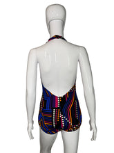 Load image into Gallery viewer, Multicolored geometric patterned swimsuit on a mannequin against a white background
