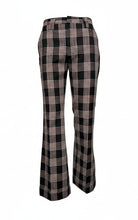 Load image into Gallery viewer, Black and white plaid pants on a mannequin against a plain background
