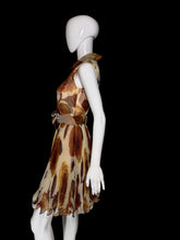 Load image into Gallery viewer, A sleeveless fit-and-flare dress displayed on a white mannequin. The dress features a brown and beige abstract leaf print on a sheer mesh fabric, with a matching waist sash and bow detail on the front.
