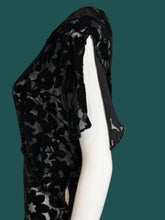 Load image into Gallery viewer, A black floral print silk burn out maxi dress displayed on a white mannequin.
