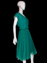 Load image into Gallery viewer, A teal Helen Rose midi dress with a ribbon detail at the collar displayed on a white mannequin.
