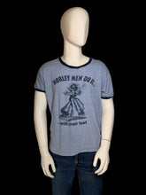 Load image into Gallery viewer, A heather blue ringer t-shirt with dark navy trim on a white mannequin. The front features a navy graphic of a man with guitar pedals for feet and the text "MORLEY MEN DO IT...with their feet"
