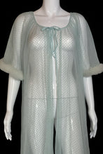 Load image into Gallery viewer, A close up of a sheer, light blue tulle mesh robe with swiss dots all over, a tie-neck detail and ruffled trim, displayed on a white mannequin.
