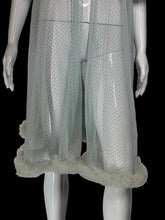 Load image into Gallery viewer, A close up of a sheer, light blue tulle mesh robe with swiss dots all over, a tie-neck detail and ruffled trim, displayed on a white mannequin.
