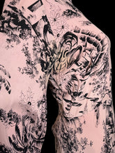 Load image into Gallery viewer, A close-up of a pink garment or fabric with an all-over black botanical and floral print, shown on a mannequin.
