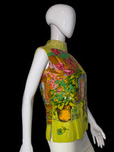 Load image into Gallery viewer, A sleeveless mock-neck top with a vibrant, colorful floral and bird print, displayed on a white mannequin.

