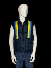 Load image into Gallery viewer, A navy blue puffer vest with bright yellow and light blue vertical stripes on the front, displayed on a white mannequin wearing blue jeans.
