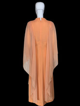 Load image into Gallery viewer, An orange vintage maxi dress with sheer draping sleeves displayed on a white mannequin.
