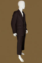 Load image into Gallery viewer, A dark brown pinstripe suit displayed on a white mannequin, featuring a two-piece jacket and trousers with a matching vest.
