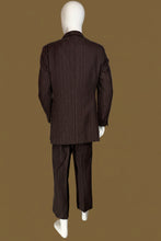 Load image into Gallery viewer, A dark brown pinstripe suit displayed on a white mannequin, featuring a two-piece jacket and trousers with a matching vest shown from the back.
