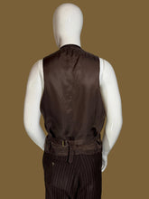 Load image into Gallery viewer, The back of a dark brown vest displayed on a white mannequin, paired with dark brown pinstripe trousers 
