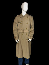 Load image into Gallery viewer, A classic Burberry double-breasted trench coat in khaki beige, shown on a white mannequin. The coat features a belted waist, shoulder epaulets, and button closures.
