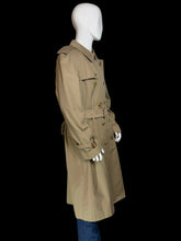 Load image into Gallery viewer, The side view of a classic Burberry double-breasted trench coat in khaki beige, shown on a white mannequin. The coat features a belted waist, shoulder epaulets, and button closures.
