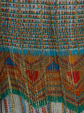 Load image into Gallery viewer, A close-up of a highly patterned textile featuring geometric designs in gold, turquoise, red, orange, and white.
