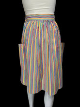 Load image into Gallery viewer, A vintage striped skirt shown on a white mannequin. The skirt features vertical stripes in yellow, blue, orange, and red on a white base, with side pockets.

