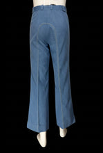 Load image into Gallery viewer, Blue denim pants with contrast light-colored stitching, displayed on a mannequin from the back
