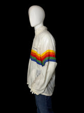 Load image into Gallery viewer, A side view of a white windbreaker jacket with a bold rainbow stripe across the chest and upper back, shown on a white mannequin.
