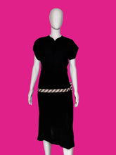 Load image into Gallery viewer, A black short-sleeve dress shown on a white mannequin, featuring a pink and white striped waist sash with a large bow at the back waist.
