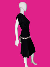 Load image into Gallery viewer, A black short-sleeve dress shown on a white mannequin, featuring a pink and white striped waist sash with a large bow at the back waist.

