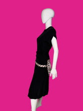 Load image into Gallery viewer, A black short-sleeve dress shown on a white mannequin, featuring a pink and white striped waist sash with a large bow at the back waist.
