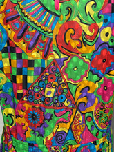 Load image into Gallery viewer, A close-up of a highly colorful, psychedelic patterned garment featuring vibrant sections of green, red, yellow, blue, pink, and purple in a patchwork design.
