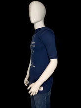 Load image into Gallery viewer, A mannequin wearing a dark navy blue short-sleeve t-shirt with a white graphic print on the front.

