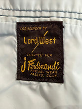 Load image into Gallery viewer, A close-up of a vintage brown fabric label with gold embroidery reading 'FORMALWEAR BY Lord West' and 'Tailored for J. Ferdinandi Formal Wear Fresno, Calif.
