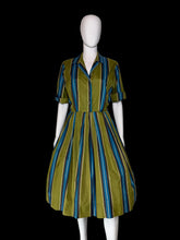 Load image into Gallery viewer, A short-sleeve collared dress with vertical blue, teal, and olive green stripes, displayed on a white mannequin.

