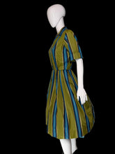 Load image into Gallery viewer, A short-sleeve collared dress with vertical blue, teal, and olive green stripes, displayed on a white mannequin.
