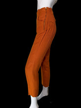 Load image into Gallery viewer, Bright orange cropped pants with a zippered front and side pockets, displayed on a white mannequin.
