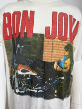 Load image into Gallery viewer, A vintage off-white Bon Jovi graphic t-shirt with a large red 'BON JOVI' logo and a graphic print of a motorcycle.
