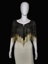 Load image into Gallery viewer, A black mesh shawl with gold sequins and fringe trim, displayed on a white mannequin torso.
