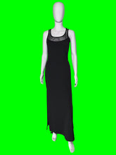 Load image into Gallery viewer, A black sleeveless maxi dress with sheer straps shown on a white mannequin from the front. 
