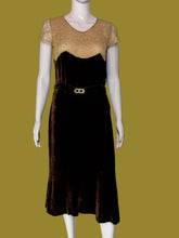 Load image into Gallery viewer, A dark brown velvet 1920s midi length dress displayed on a white mannequin. 
