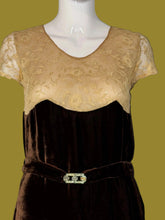 Load image into Gallery viewer, A close up of a dark brown velvet 1920s midi length dress displayed on a white mannequin featuring a matching belt. 
