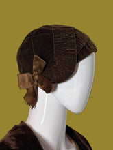 Load image into Gallery viewer, A brown textured fabric cloche hat with a matching satin bow, displayed on a white mannequin head.

