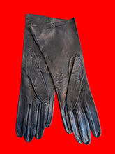 Load image into Gallery viewer, A pair of long black leather gloves laid flat showing the black leather underside.
