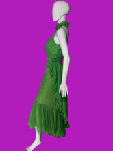 Load image into Gallery viewer, A bright green halter-neck maxi dress displayed on a white mannequin.
