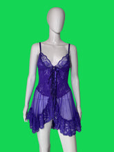 Load image into Gallery viewer, A purple lace babydoll chemise with sheer mesh and ruffled trim, displayed on a white mannequin .
