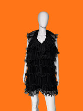 Load image into Gallery viewer, Black ruffled tulle dress shown on a white mannequin featuring a tiered ruffle skirt and a sheer ruffled collar.
