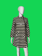 Load image into Gallery viewer, A black and cream striped long-sleeve jacket with a glossy finish, displayed on a white mannequin.
