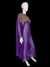 Load image into Gallery viewer, A purple sheer maxi dress with a high embroidered neckline and long draped sleeves, displayed on a white mannequin.
