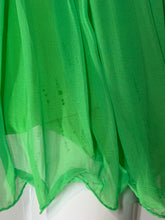 Load image into Gallery viewer, A close-up of a bright green tulle fabric against a white mannequin. 
