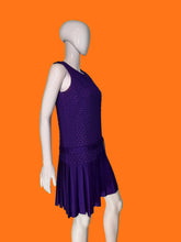 Load image into Gallery viewer, A purple sleeveless dress with a textured bodice and pleated skirt, displayed on a white mannequin.
