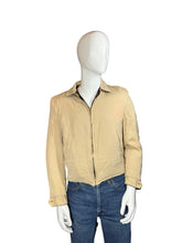 Load image into Gallery viewer, Beige jacket on a mannequin with blue jeans, against a plain background
