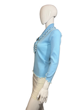 Load image into Gallery viewer, Mannequin wearing a light blue top with lace trim against a plain wall.
