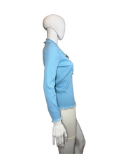 Load image into Gallery viewer, Mannequin wearing a light blue top against a plain wall.

