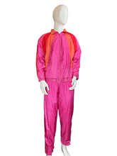 Load image into Gallery viewer, Mannequin wearing a pink and orange ski suit on a white background
